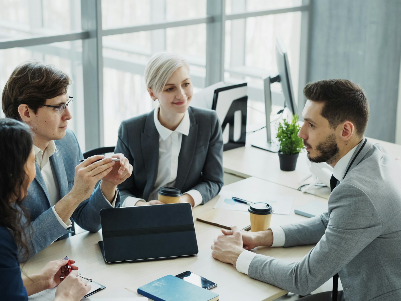 A team working through a problem together at a table